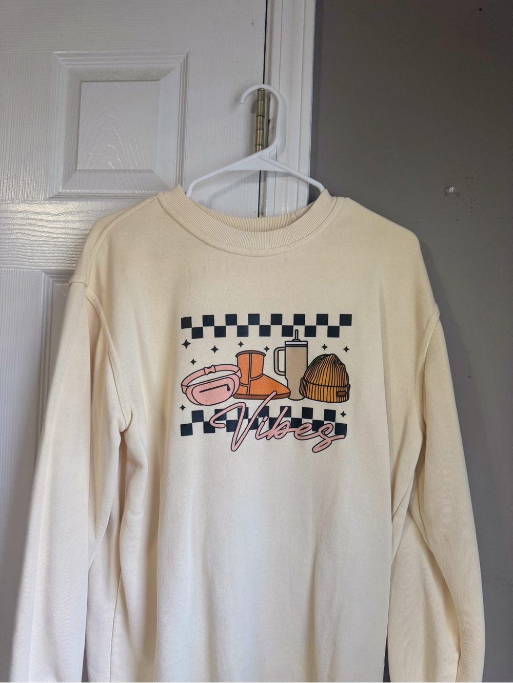 Cream long sleeve sweatshirt with cute graphic, size S